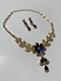 Conjunto dorado con piedras azules